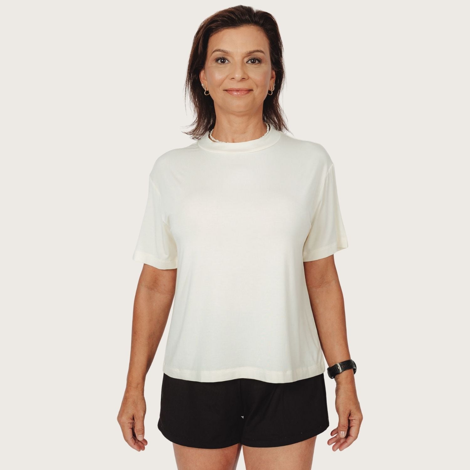Woman wearing Lyvora Breeze Tee made with TENCEL™ Modal fabric — breathable and soft.