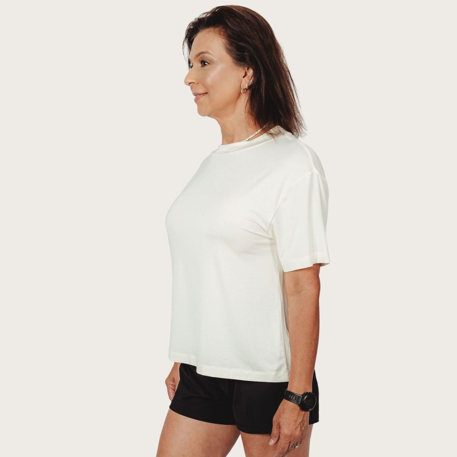 “Lyvora Breeze Tee side view showing soft drape that doesn’t cling.