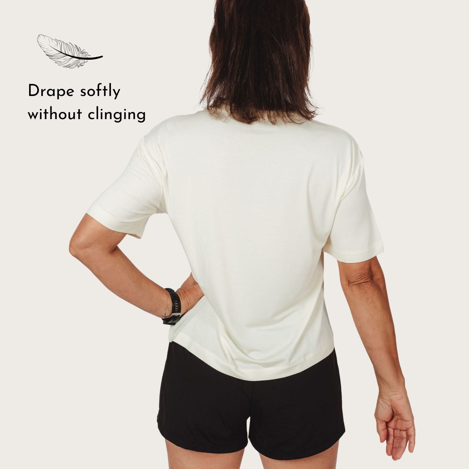 Back view of Lyvora Breeze Tee showing relaxed drape and smooth shoulder fit.
