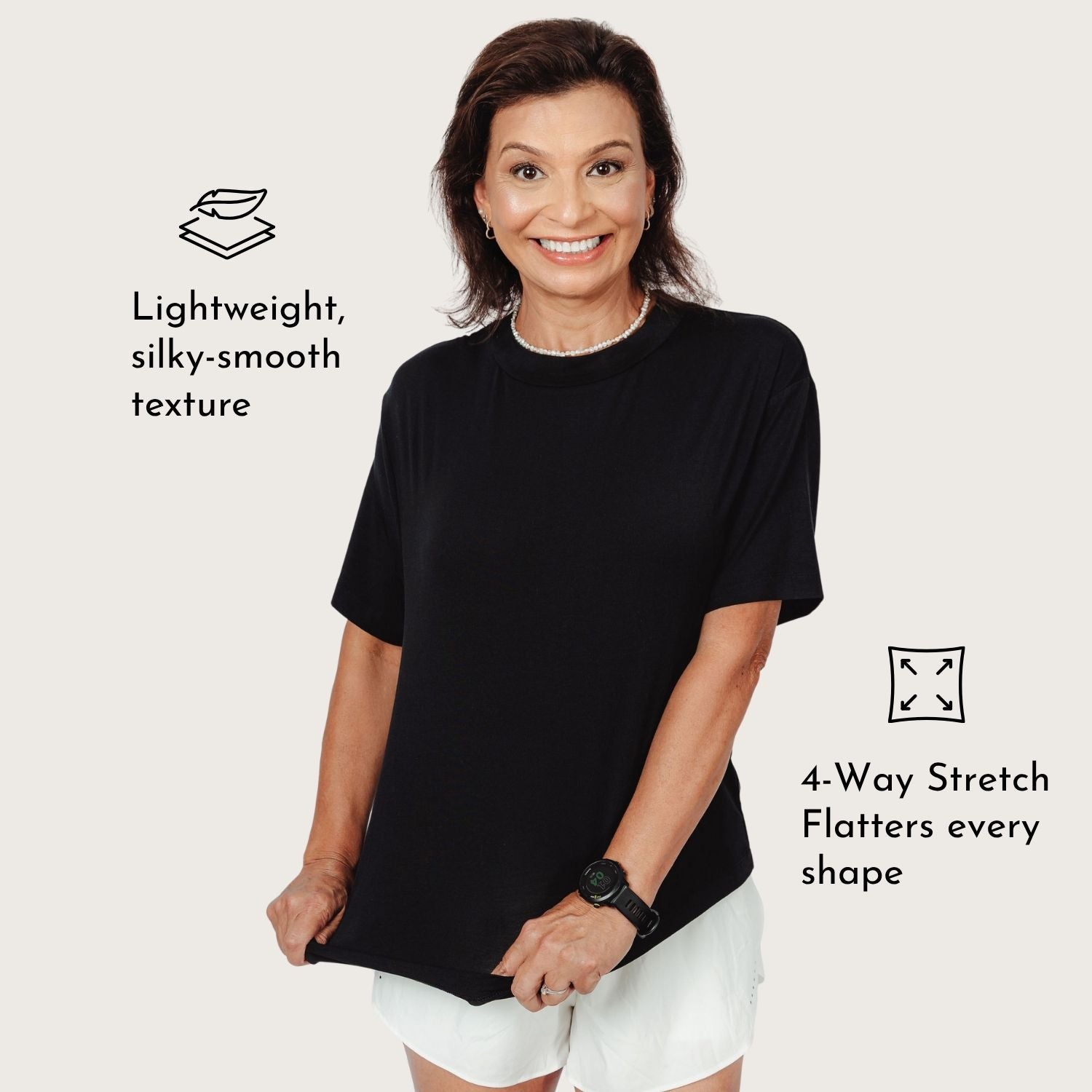 Woman wearing Lyvora Noir Breeze Tee showing lightweight silky-smooth texture and 4-way stretch comfort.