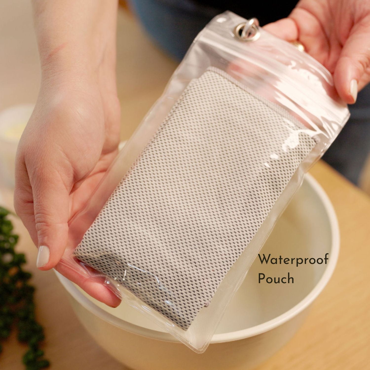 Cooling towel packaged in waterproof pouch for easy carrying.