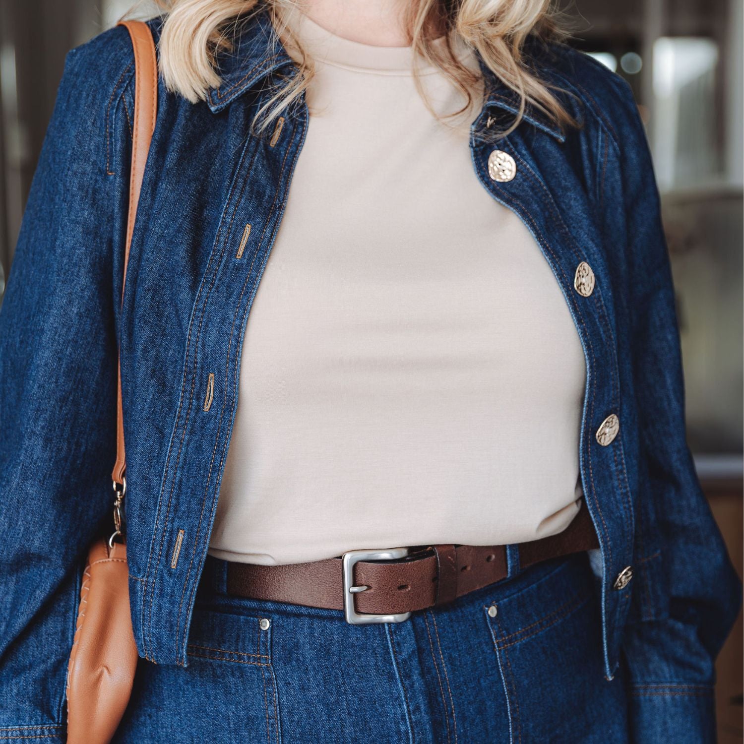 Lyvora Sand Drift Breeze Tee styled with denim jacket for a relaxed everyday outfit.