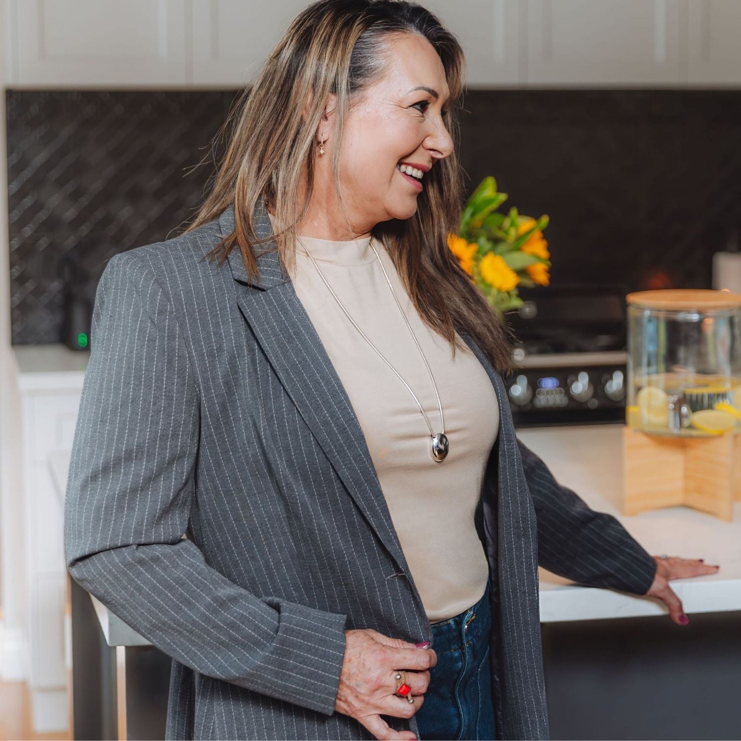 Lyvora Sand Drift Breeze Tee dressed up with a blazer for a chic smart-casual look.