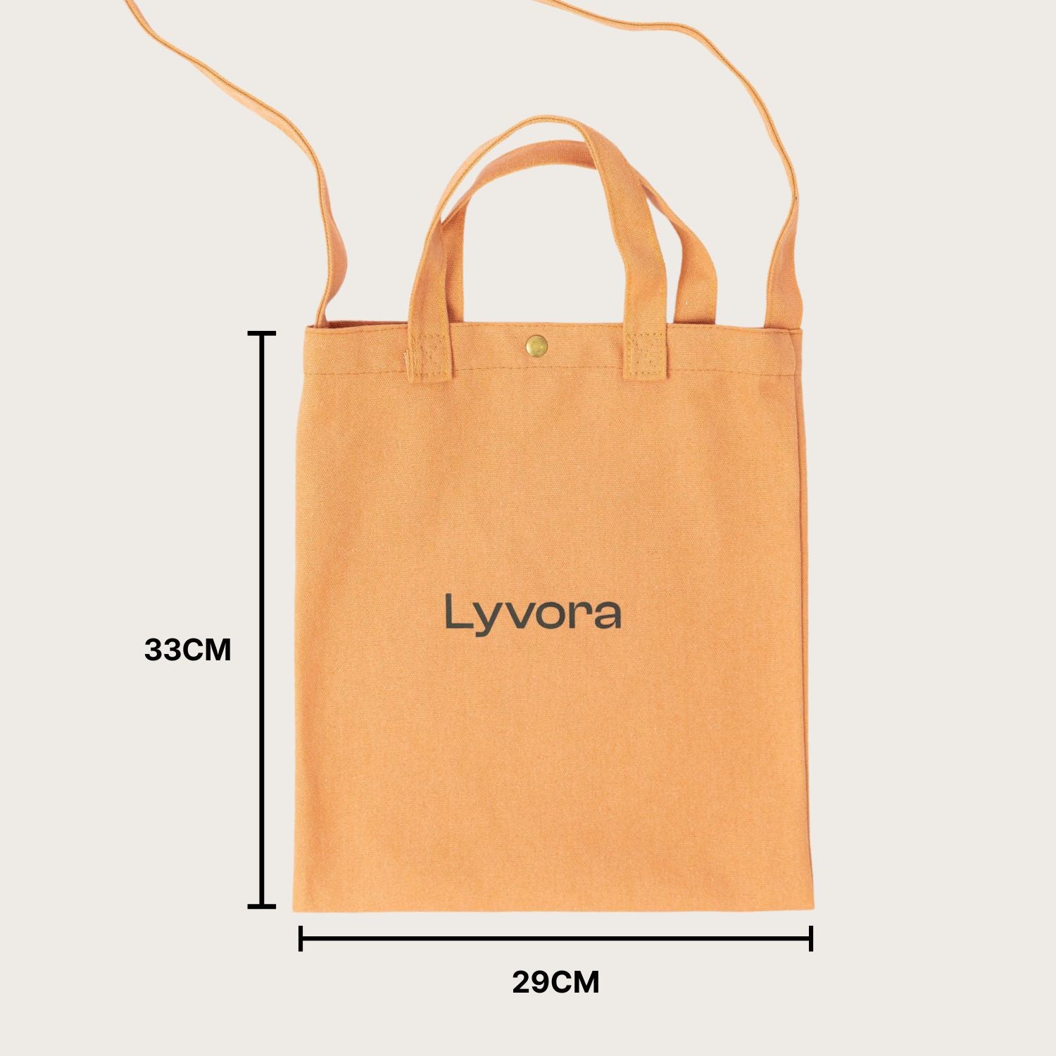 Beige canvas tote bag by Lyvora with crossbody strap and handles, minimalist flat lay